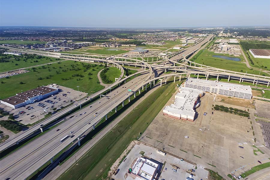 Katy, TX - Aerial View of a Multi Lane Highway Running Through the City of Katy Texas on a Sunny Day